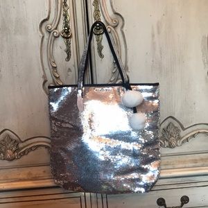 Silver sequined tote with Pom Poms dangling